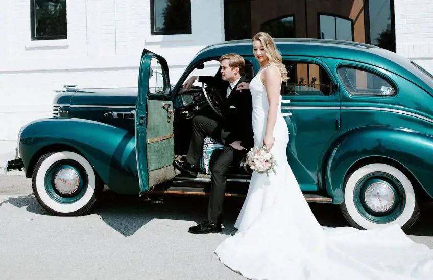 Bride and Groom in a green vehicle