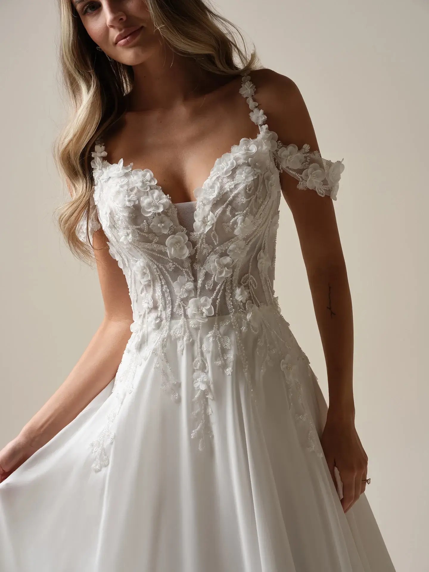 A 3D floral wedding dress with v-neckline, A-line bridal gown from Maggie Sottero