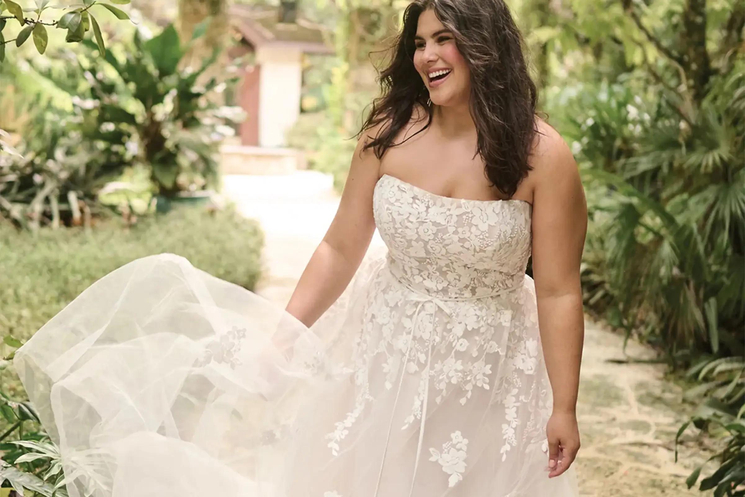 Plus size model wearing a white bridal gown