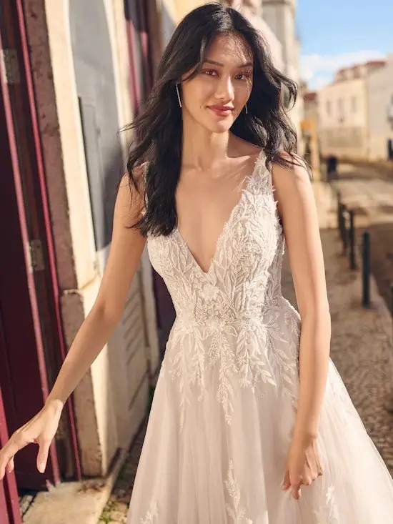 Model wearing a white bridal gown